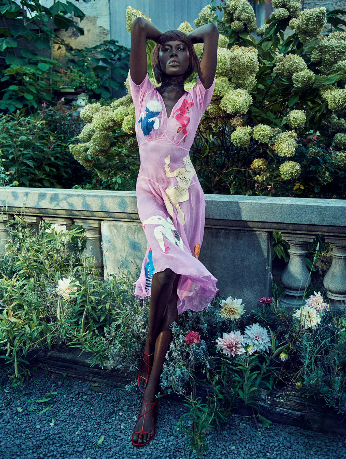 Ajak Deng Poses In A Blooming Paradise for ELLE UK