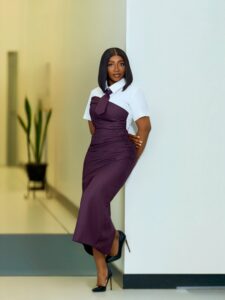 Structured purple and white modern statement shirt dress with an attached tie.