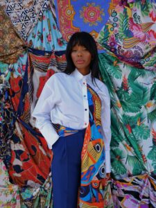White button-down shirt restyled with a colourful printed silk scarf drape.