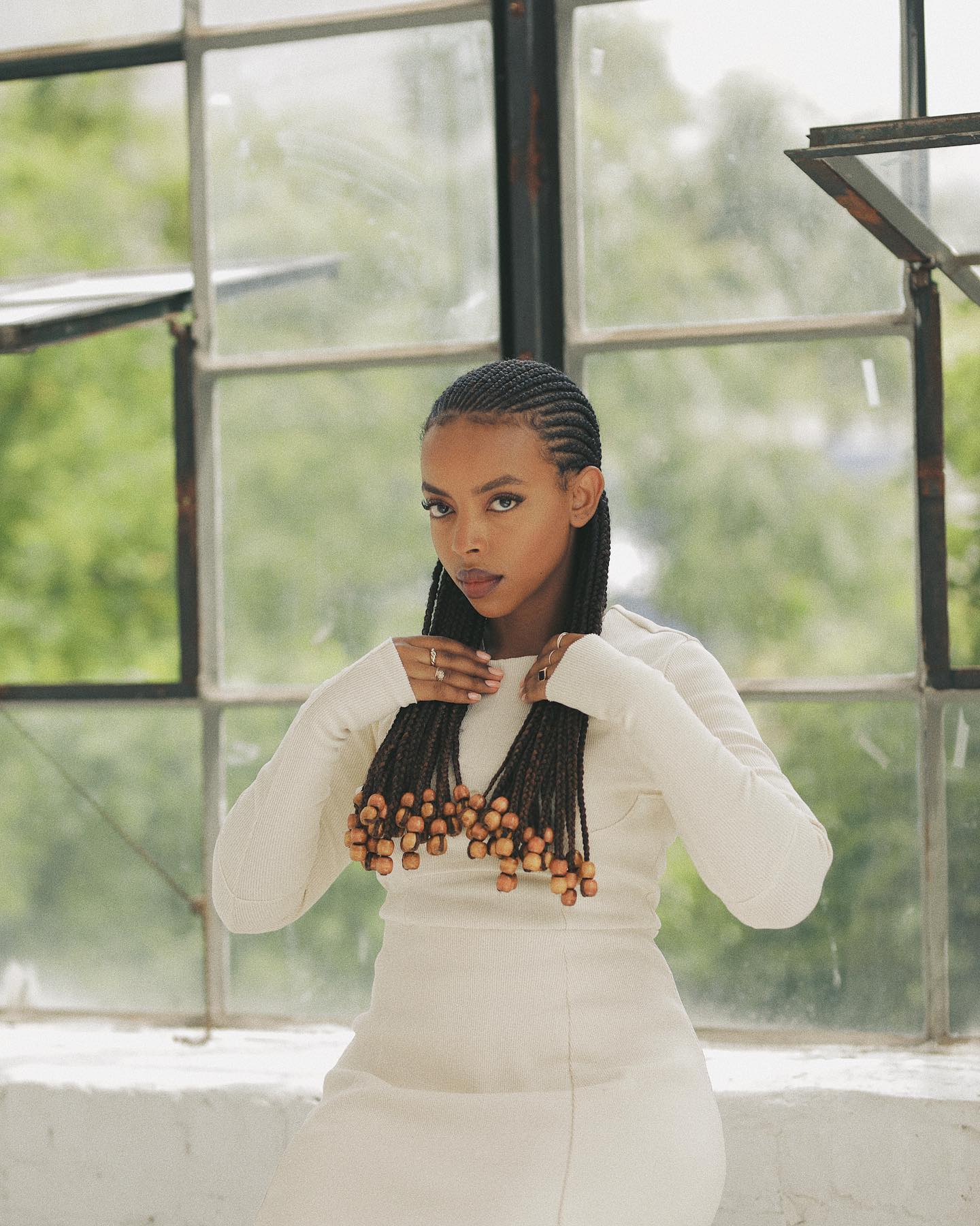 Straight black all-back cornrows with beads
