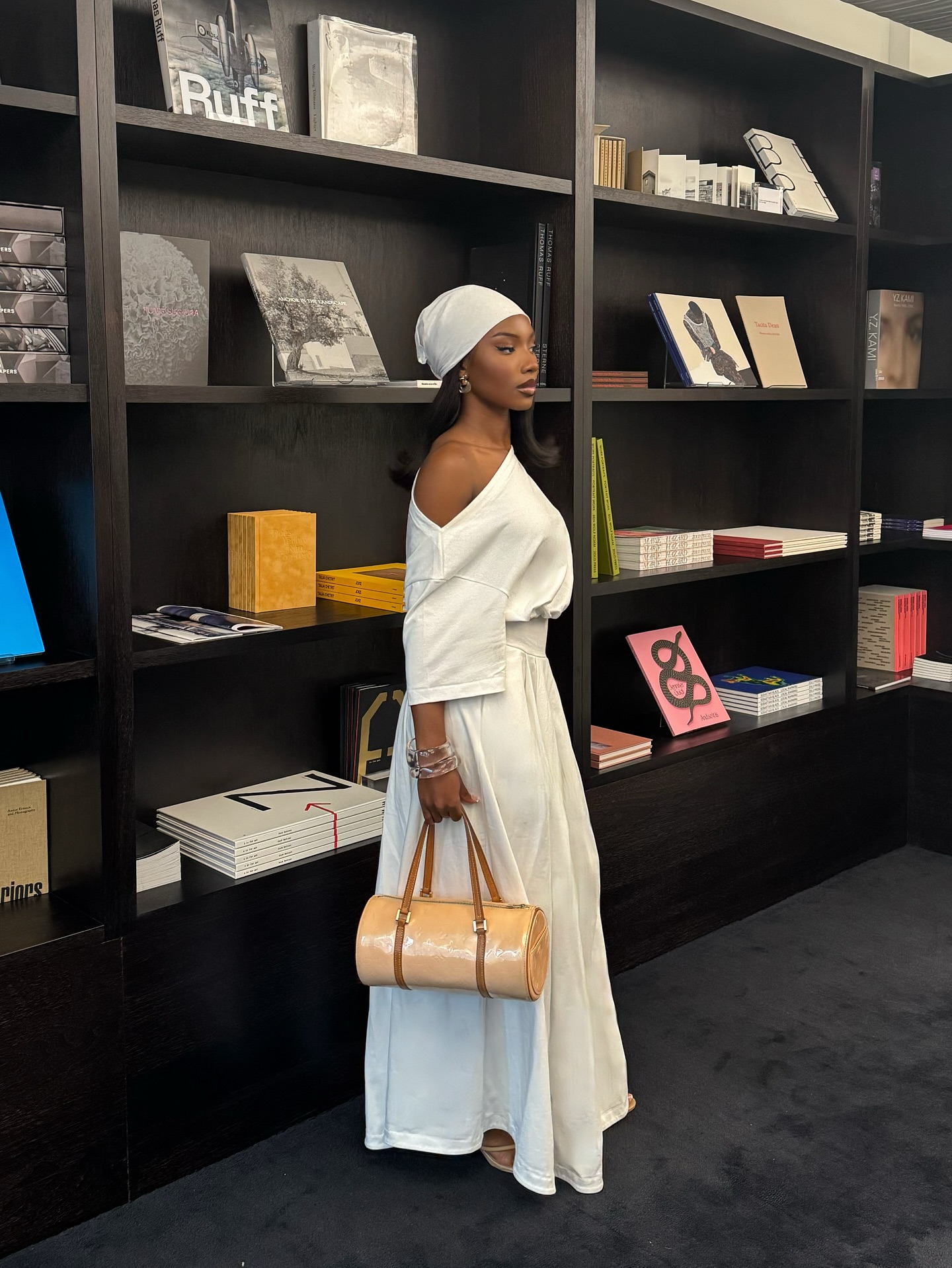 Off-shoulder white monochrome outfit with a headscarf