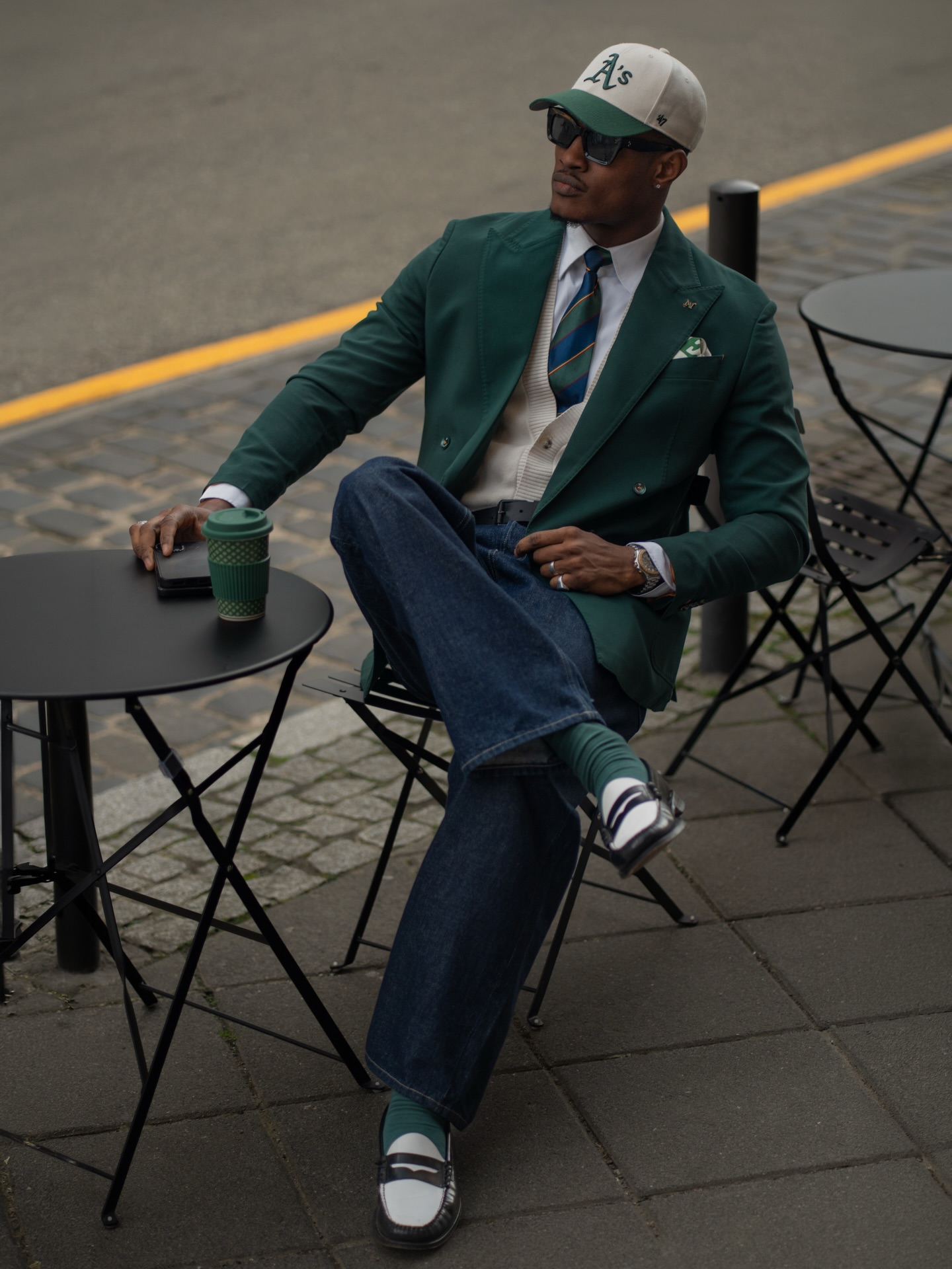 Green blazer and baseball cap