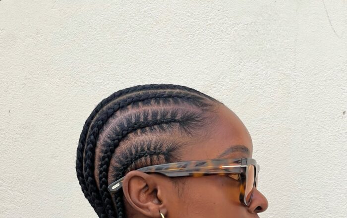 Short stitch straight all-back cornrow hairstyle with beads