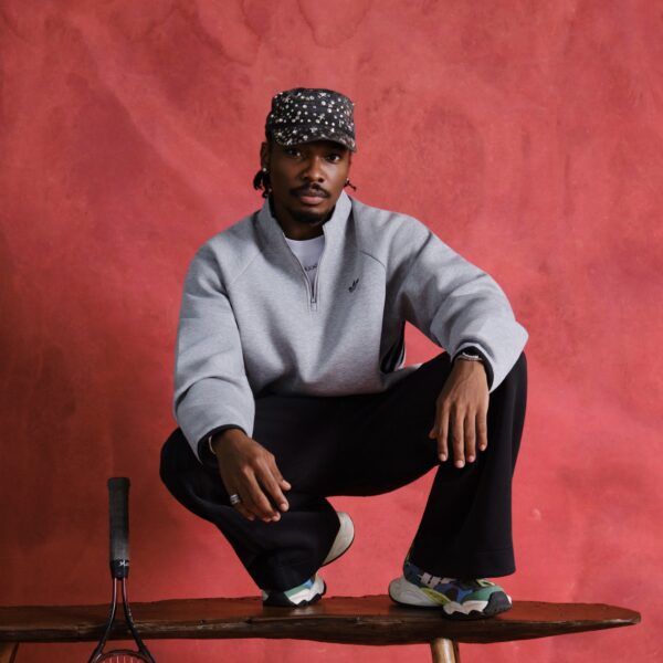 Mike Afolarin in a grey Adidas sweatshirt