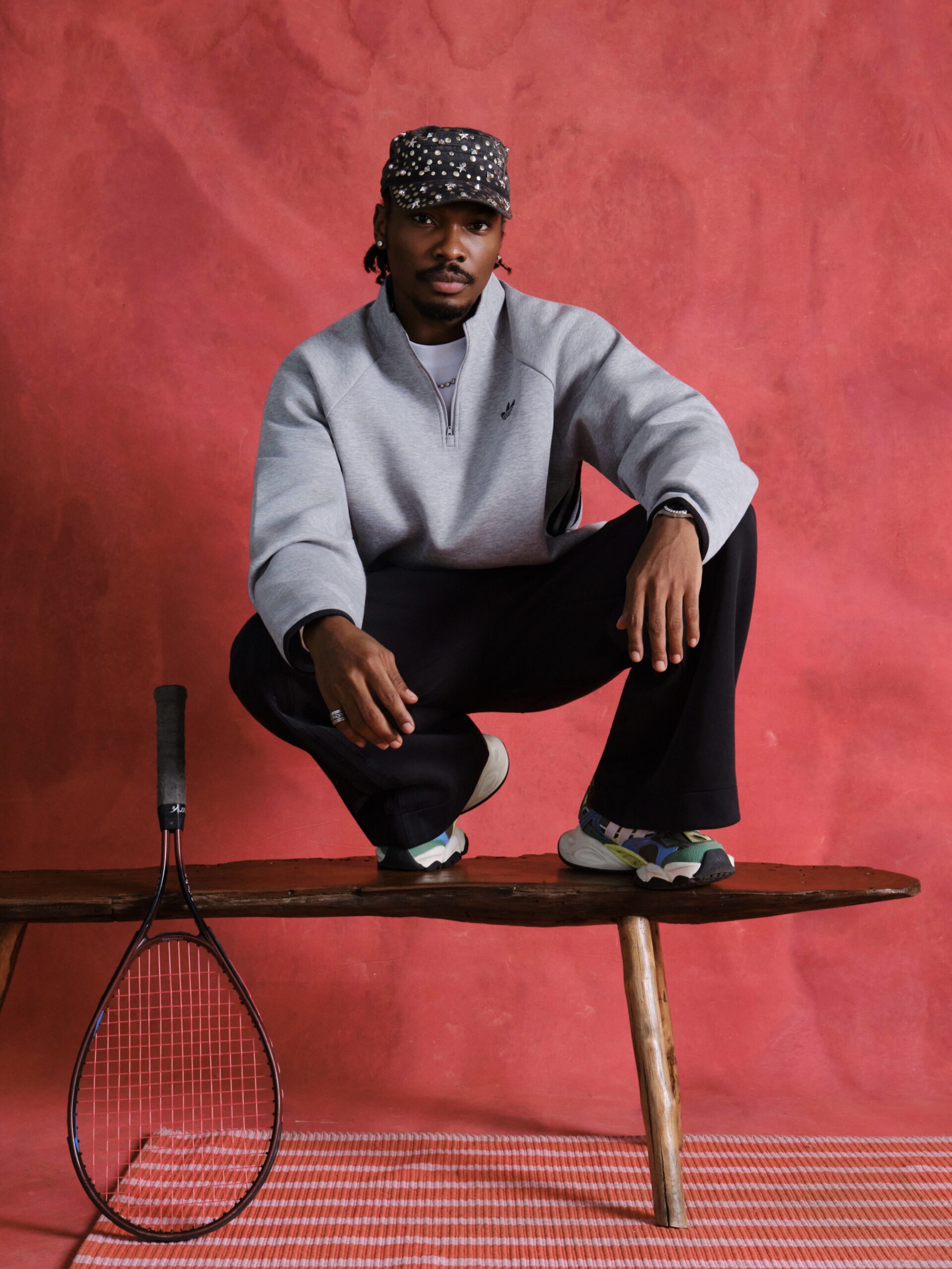 Mike Afolarin in a grey Adidas sweatshirt