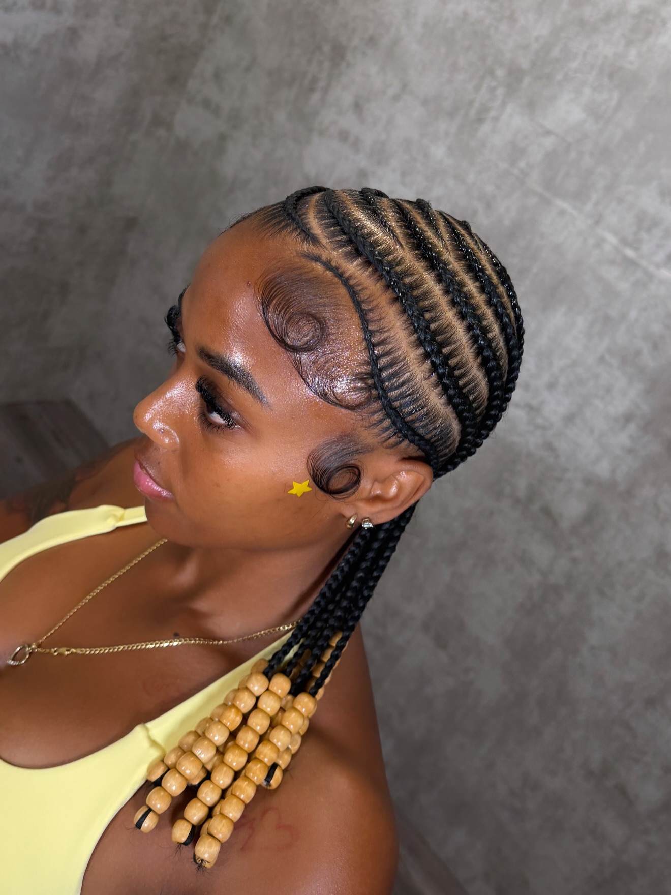 Curved stitch cornrows with wooden beads
